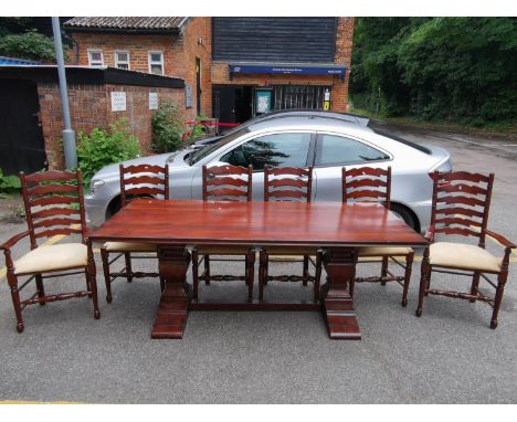 A good quality modern cherrywood dining table, 80 h x 214 w x 102 d, with six matching ladder back chairs to include two carv