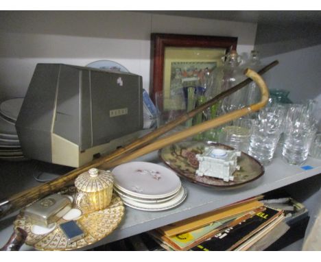 A mixed lot comprising mixed glassware, a vintage tripod, a Cecil Aldin print, two walking canes, mixed ceramics and an autom