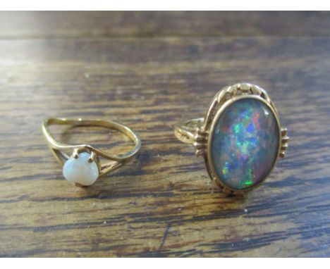 A 10ct gold and opal set ring, along with a 10ct gold and heart shaped opal ring A/F, total weight of the largest opal ring a