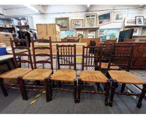 A Harlequin set of six oak dining chairs with rush seats to include a pair of ladder backs and a set of four spindle backs 