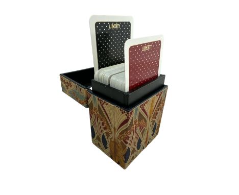 A Liberty of London playing card case containing two sets of playing cards 
