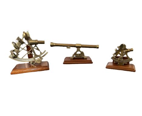 Scientific Instruments 20th Century brass range with sextant (19cm tall) mounted on wooden plinth, sextant (12cm tall) on woo