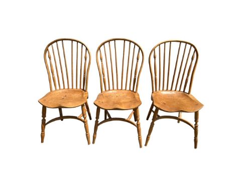 Three Ercol style hoop back dining chairs. 