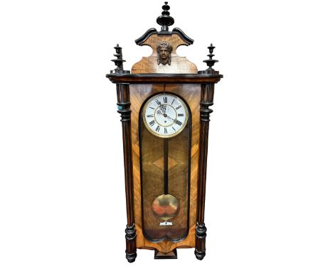An attractive wall clock.&nbsp; Approx 115cm in height. Wood split in some areas, see photos.