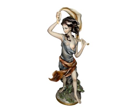 A Joseph Barbetta Capodimonte Italian Flavia figurine of a partially nude woman. Signed ‘Barbetta’ to base with Flavia and cr