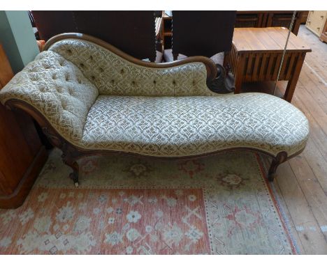 Mahogany framed Victorian Chaise Longue on carved cabriole legs on casters, the button fold top and back and padded seat upho