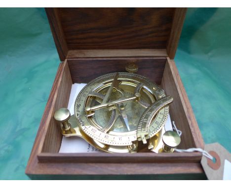 Brass sun dial/compass in polished mahogany case