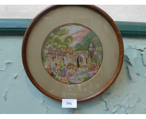 Oak framed circular panel inset tapestry of a garden  