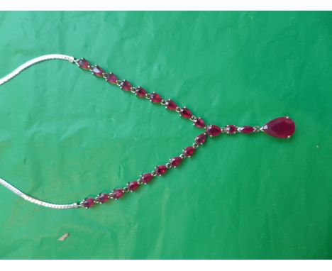 Sterling silver 18" ruby necklace in decorative red purse