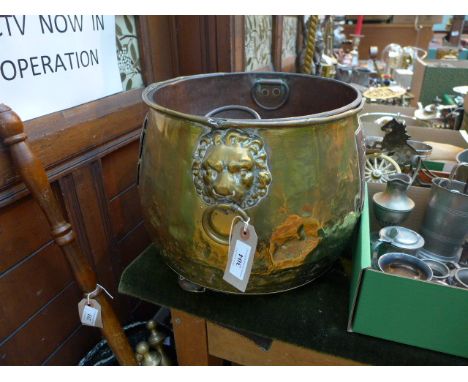 Large brass coal scuttle with tin liner, fitted lion mask handles and copper panel to front