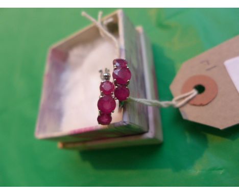 Pr. sterling silver hooped ruby stone earrings