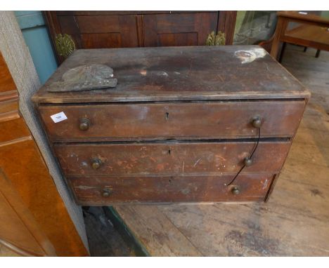 Brown painted pine chest of three long drawers containing a selection of old hand tools, joiners plane etc.