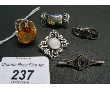 A single stone citrine dress ring, together with an Art Nouveau silver brooch and three others.