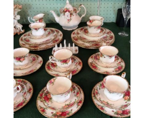 A Royal Albert Old Country Roses part-tea service, a six place setting, to include: trios, dinner plates, teapot and other it