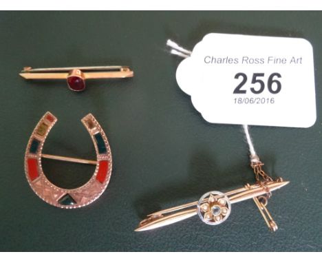 An aquamarine and seed pearl foliate cluster bar brooch, together with a Victorian rose gold and agate horseshoe brooch and a