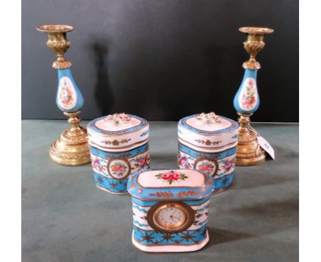 A 20th century Continental porcelain and gilt metal part-dressing table set, comprising twin candlesticks, a pair of covered 