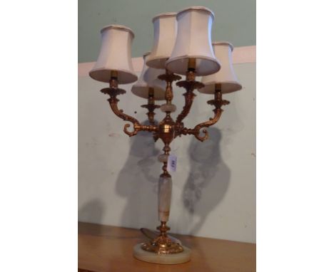 An onyx and brass mounted table lamp, the central sconce circled by four further sconces on circular foot (68cm to include sh
