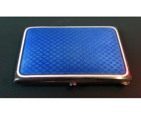 A small Continental silver cigarette box, having azure blue enamel decoration to the exterior 
(8 cm x 6cm). Condition Report