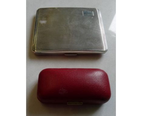 A silver cigarette case with engine turned decoration, together with a pair of silver cufflinks in fitted case.