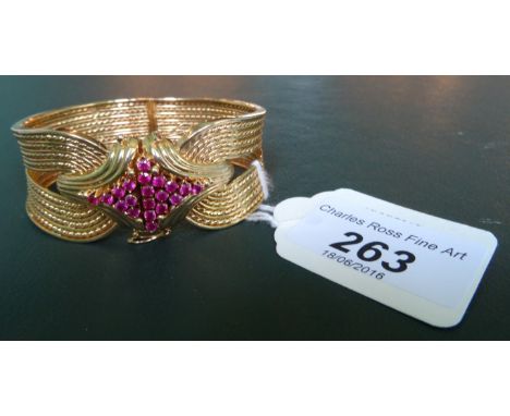 A synthetic ruby rope twist bangle, the concealed opening with lozenge shaped synthetic ruby cluster, to multi strand rope tw