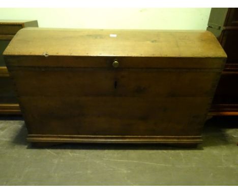 A large 19th century oak domed top trunk (63cm x 125cm x 81cm).