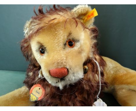 A mid-20th century Steiff Leo Lion, original paper swing tag to collar and brass button to left ear, golden mohair, black and