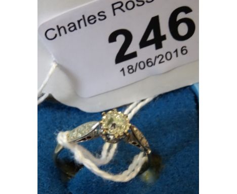 A single stone diamond ring, the old cushion cut diamond in raised contained claw mount, with three stone diamond shoulders t