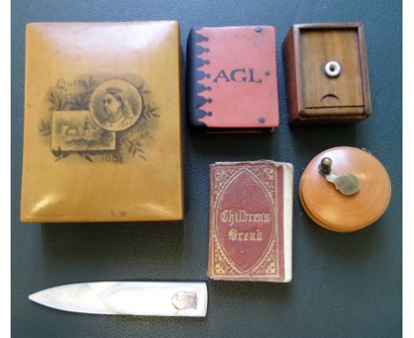 A treen hinged lidded box, commemorating Queen Victoria's Jubilee year of 1887, together with a wooden matchbox, a treen tape