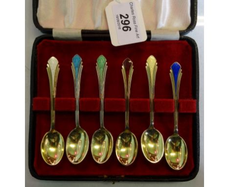 A cased set of six Meka Danish silver gilt Art Deco coffee spoons, each having different coloured enamel finials. Condition R