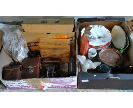 Two boxes of assorted items, to include: cigarette cards, cameras, a Kodak slide projector, ceramic plates and other items.