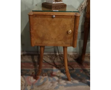 A pair of mid-20th century walnut bedside cupboards, having pull-out shelf over single door on four out-swept supports (39cm 