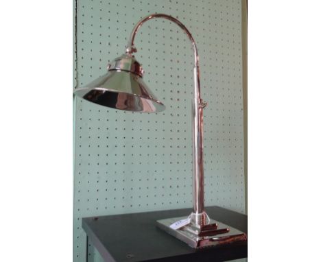 An Art Deco-style, height adjustable silver plated desk lamp.90