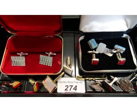 A pair of silver and enamel cufflinks depicting a terrier, together with a small quantity of further cufflinks.
