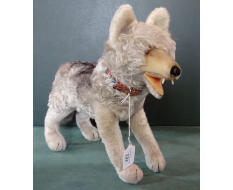 A Steiff Standing Loopy Wolf, grey mohair with shorter mohair mussel, ears and legs, open felt mouth with plastic teeth, circ
