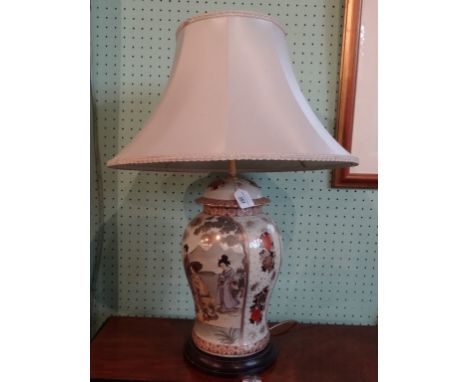 A ceramic baluster shape table lamp, having Japanese Satsuma-style decoration on a circular wooden base (72cm to include shad