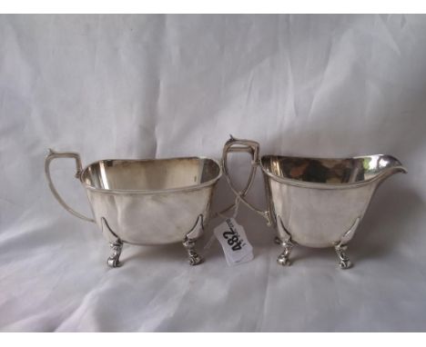 Good quality cream jug and matching sugar basin with volute support 6.5” over handles Birm 1940 by   Goldsmiths 400g       
