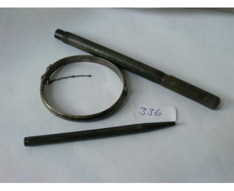 Two pencils and a bangle      