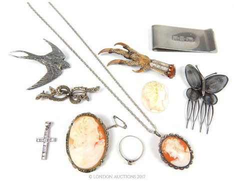 A collection of silver items and cameos to include three silver brooches, a silver filigree butterfly hair comb, silver ring,