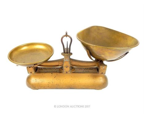 A set of W & T Avery Ltd of Birmingham gilded cast iron weighing scales, marked 'To weigh 4lb', 20 x 44 x 26cm.
