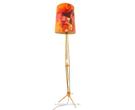 A mid 20th century wooden standard lamp on a tripod base with original colourful, fabric shade, height 140 cm, or 180cm with 