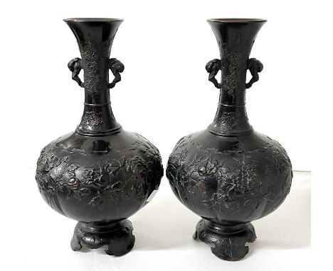 A pair of Japanese pottery vases decorated in simulated bronze style with floral decoration, 26cm high