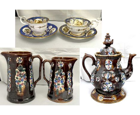 A large Barge ware teapot and cover on matching stand together with two Barge ware jugs and two 19th Century Davenport cups a