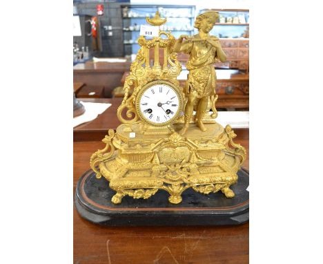 A 19th Century French gilt metal mantel clock with white enamel dial and movement striking on a bell (untested), the elaborat