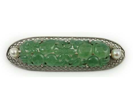 A mid 20th century pierced white gold?, jade and two stone cultured pearl set ovoid brooch, the stone carved with fruit and f