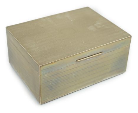 A large George V engine turned silver mounted cigar/cigarette box, by Goldsmiths &amp; Silversmiths Co Ltd, of rectangular fo
