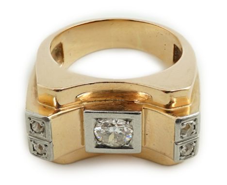 A 1940's 18ct gold and four stone diamond set 'tank' dress ring, the central round brilliant cut stone weighing approximately