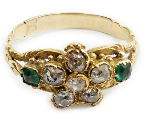 A Victorian gold, emerald and diamond set cluster ring, with central flower head motif and emerald set shoulders, size M, gro