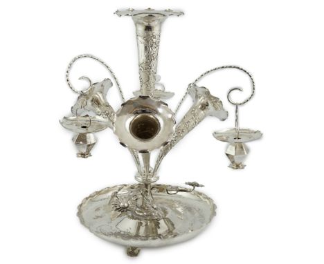 A large early 20th century Chinese silver epergne, with four trumpet shaped receivers decorated with prunus and three hanging