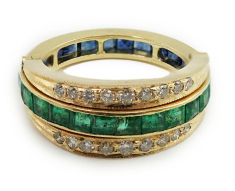 A recent gold, emerald, sapphire and diamond set triple band swivelling eternity ring, size N/O, gross weight 6.5 grams.**con