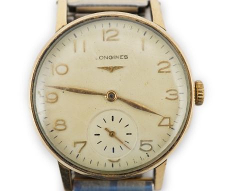 A gentleman's late 1950's 9ct gold Longines manual wind wrist watch, with Arabic dial, subsidiary seconds and initials engrav